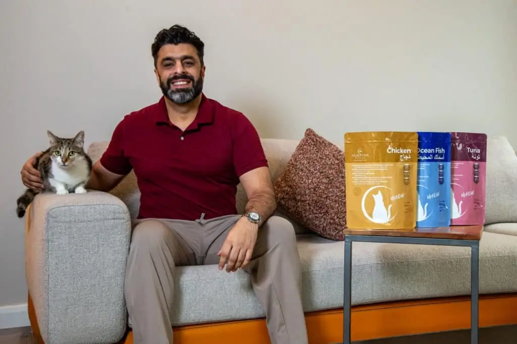 Aihtsham Rashid, CEO of Hurayra, with a cat and the Hurayra range